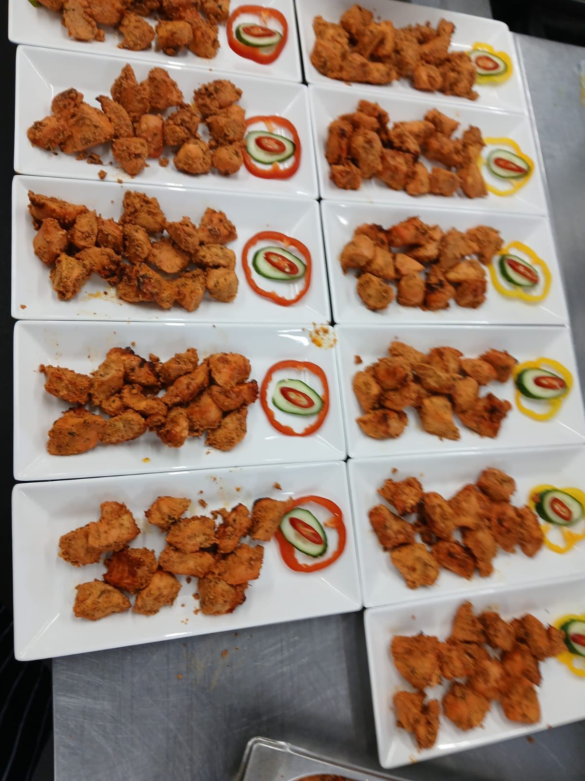 Chicken tikka plated for a formal dinner