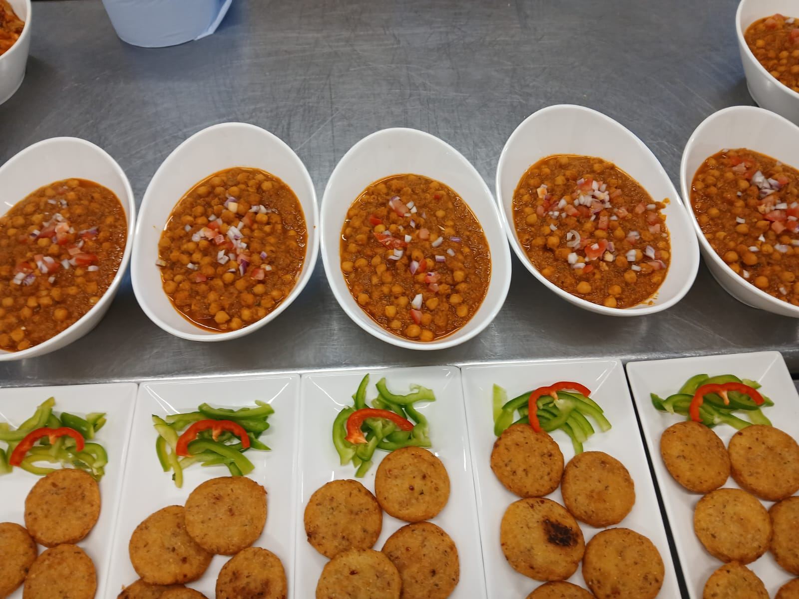 Chole bowls served with crisp papad