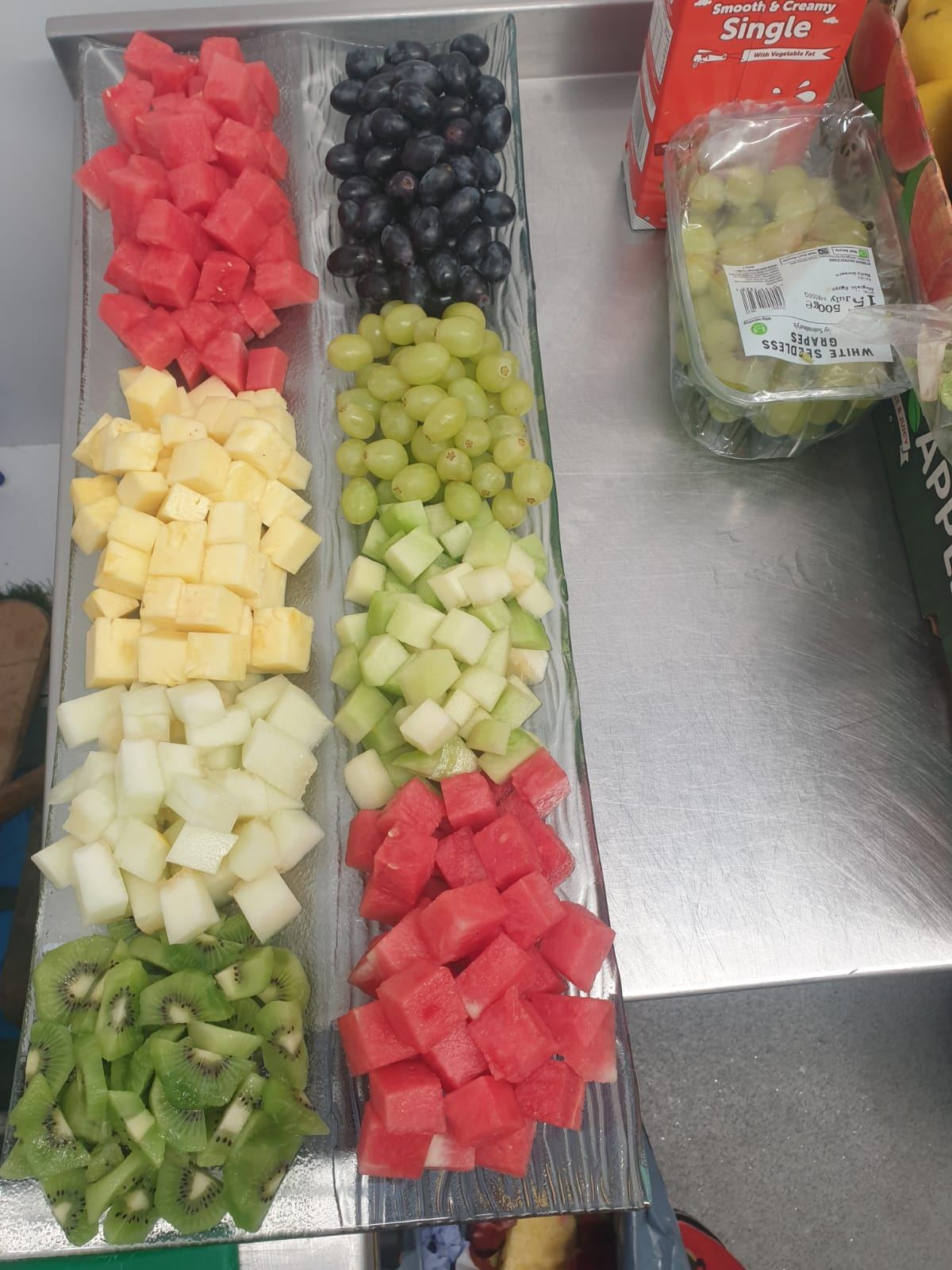 Fresh fruit platter with watermelon, grapes and kiwi