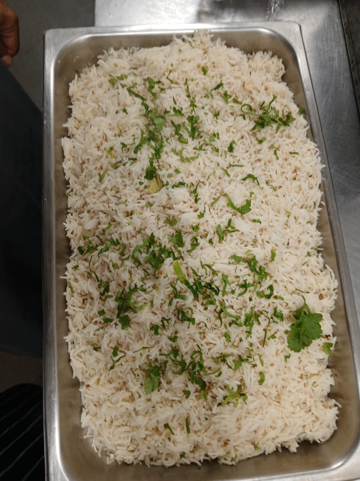 Fragrant jeera rice garnished with coriander