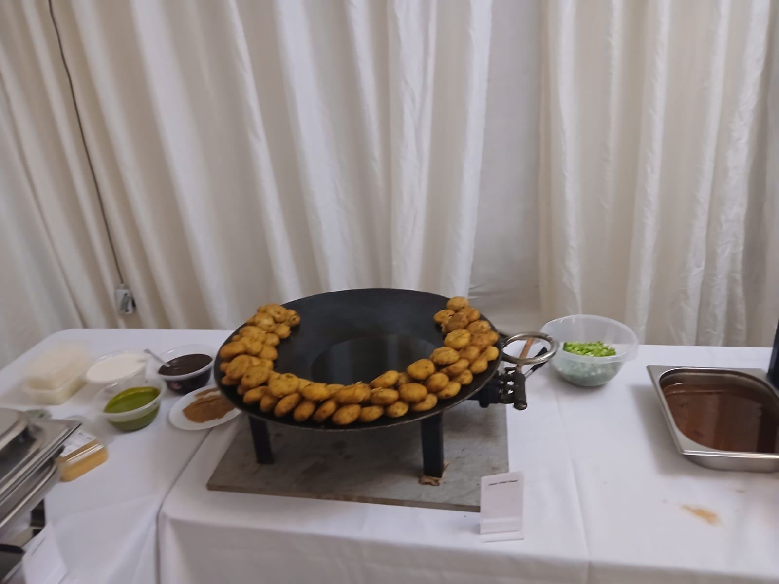 Live pakora counter being cooked fresh at a Harman Catering event