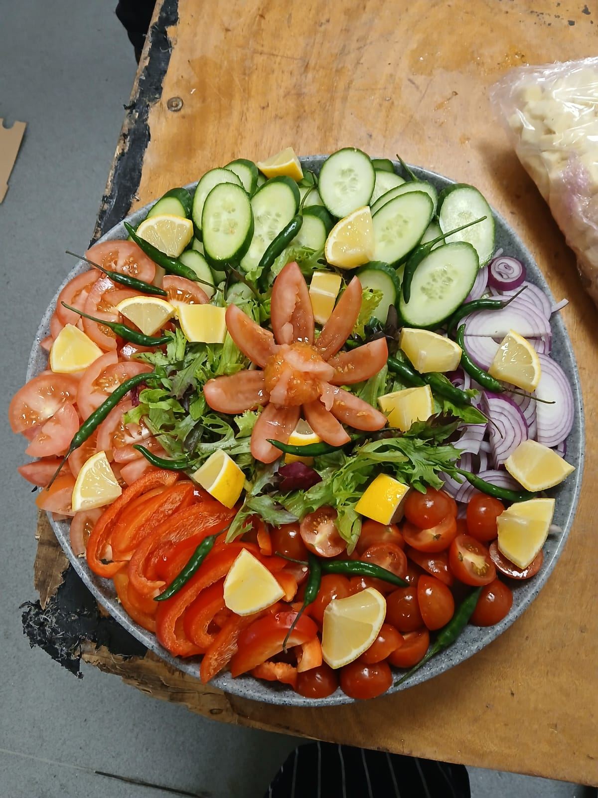 Fresh salad platter arranged in a flower pattern
